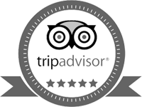 This image is a TripAdvisor logo with five stars below it, enclosed in a circular badge with a ribbon beneath the circle, symbolizing a high rating.